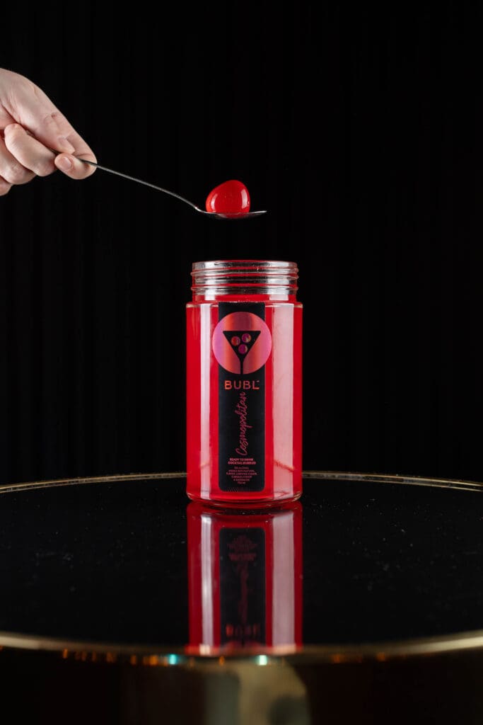 Female model with a Bubl shot on a spoon.